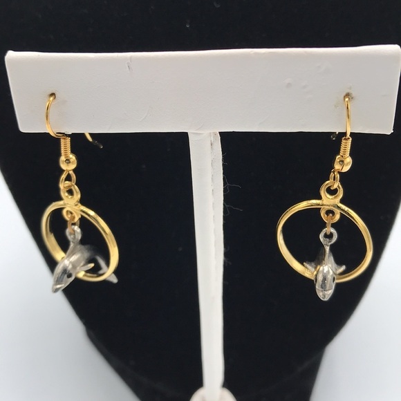 Silver tone dolphin jumping through gold tone hoop earrings - Picture 3 of 6